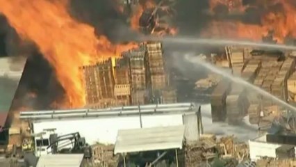 Giant fire breaks out at an industrial site in California