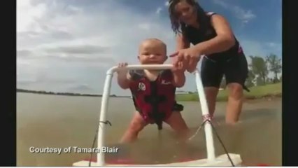 Seven-month-old baby too young to walk learns to water ski