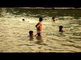 Boys splashing around in Delhi