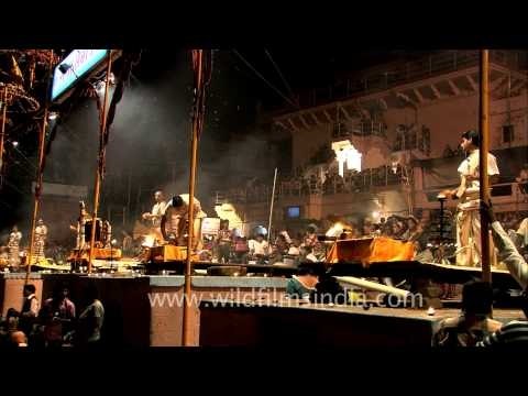 Priests performing evening Ganga aarti on the banks of Varanasi