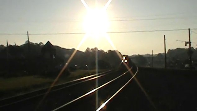 Train meet. One northwest bound BNSF coal train and one southeast bound N.S. stack train.