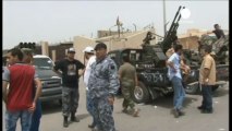 Former Libyan rebels lift siege of government ministries