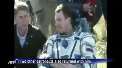 Canadian ISS astronaut returns to Earth a star