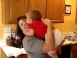 Funny baby kissing attack on mom