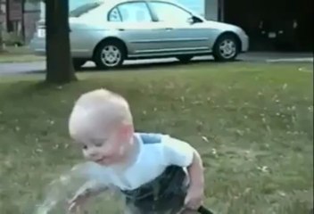 Baby tries to drink from hose -  Very funny