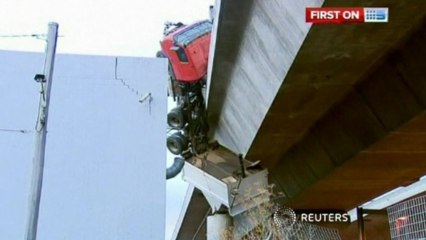 Truck driver survives 20 metre fall in bridge incident