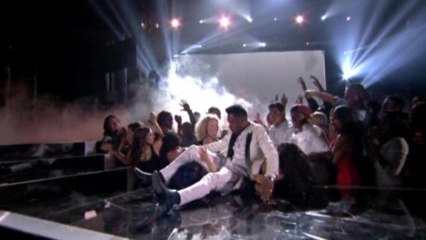 Miguel lands atop fans during Billboard Awards performance