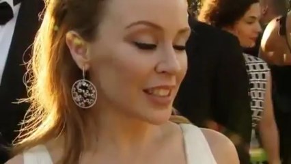 Kylie Minogue - Commends Angelina Jolie Over Breast Surgery (amfAR 2013)