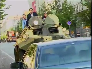 Vilnius mayor a.Zuokas fights illegally parked cars with tank