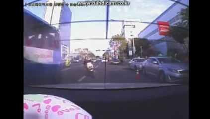 A girl riding a scooter crashes against a car!!