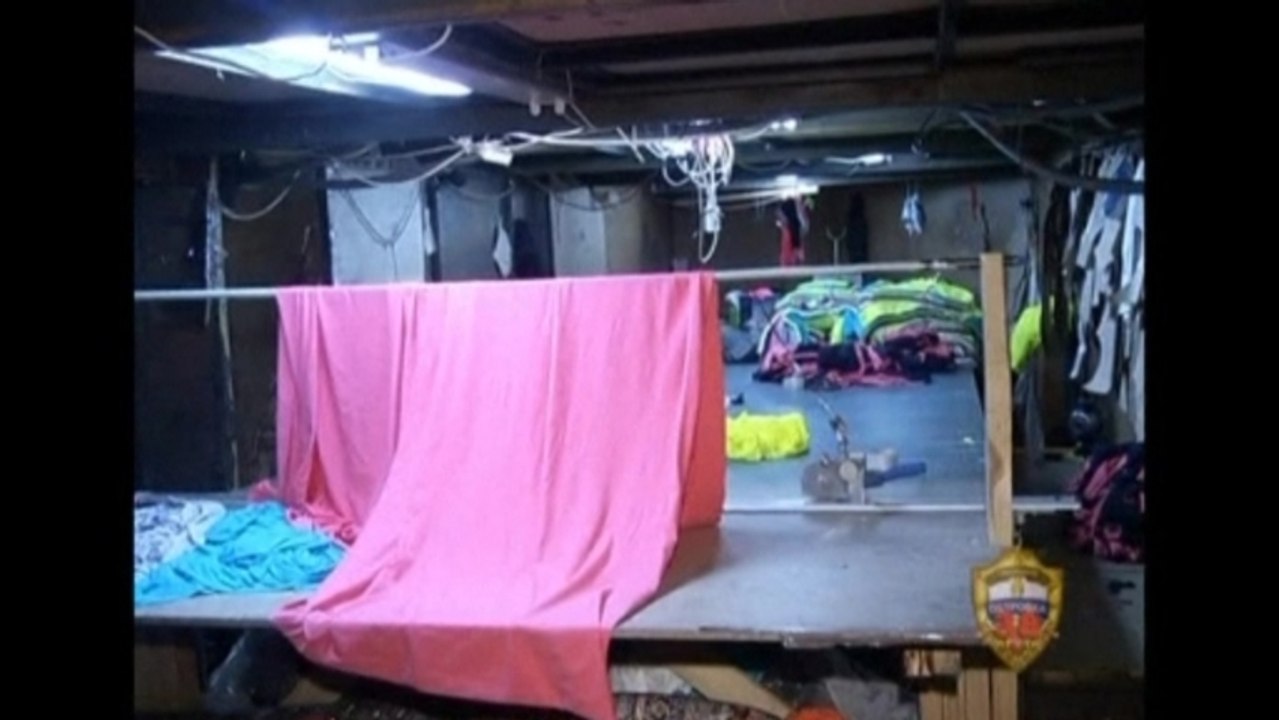 Russian police raid underground worker 'town'