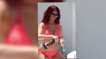 Amy Childs Wears a Barely There Pink String Bikini