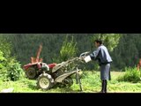 Bhutanese farmer moving a power tiller