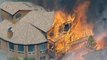 US wildfires destroy scores of homes