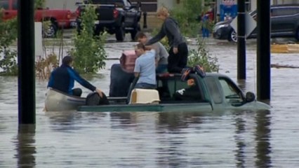 Flood waters rage through Alberta towns