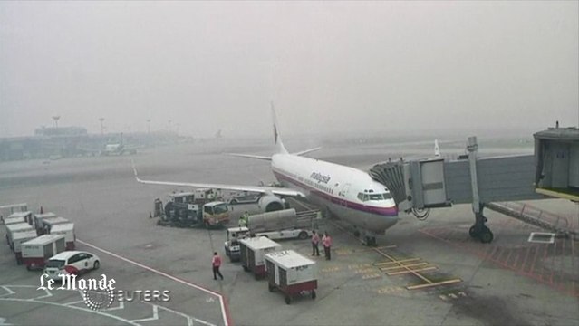 Singapour noyé sous un épais nuage de fumée