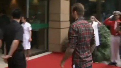 David Beckham pulls funny faces visiting children in China