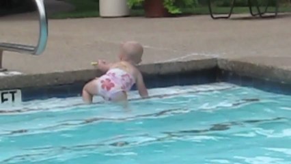 Toddler swims solo in the pool