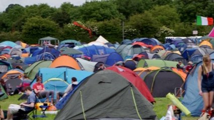 Revelers in wellington boots arrive for Glastonbury