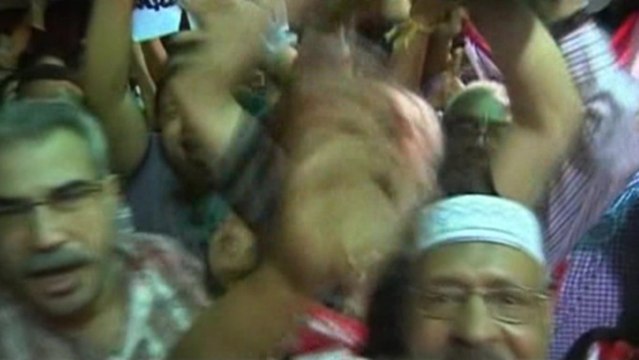 Cheers, fireworks in Tahrir Square after Mursi announcement