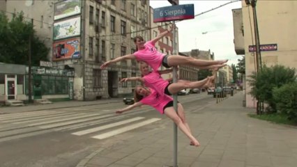 Polish poledancers show moves on street corners
