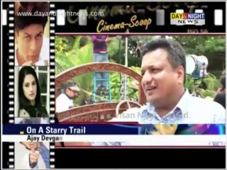 Ajay Devgan models for a suitings advertisement