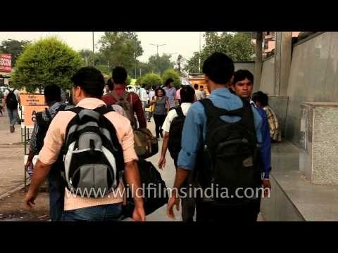 People come and go at the Saket Metro Station