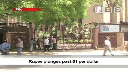 Rupee plunges past 61 per dollar
