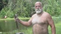 This guy catches a fish with hands