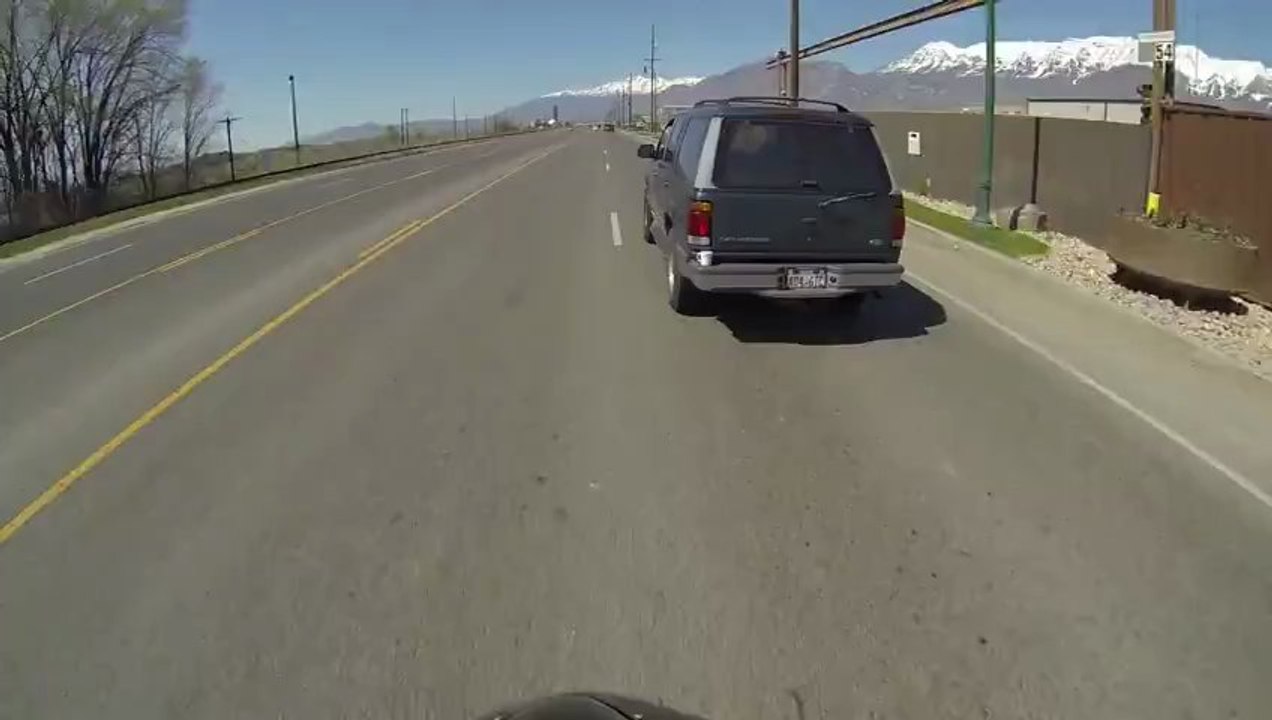 Motorcyclist Saves Cup on a car!