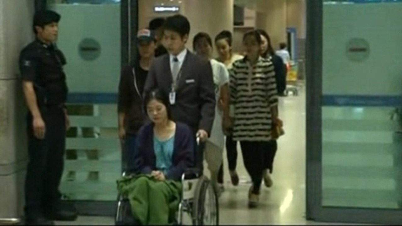 Asiana flight attendants return to South Korea after plane crash