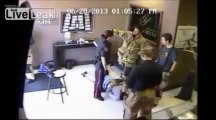 Store owner knocks out robber with a baseball bat