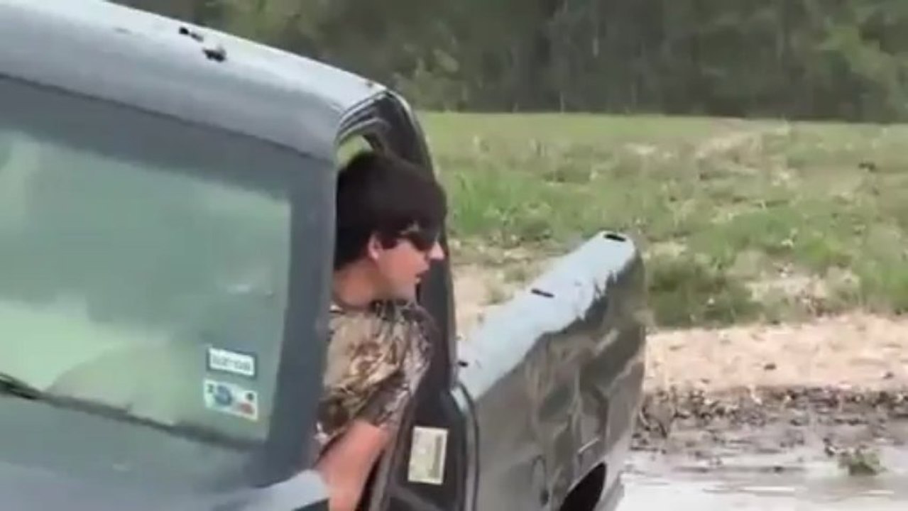 guy jumps Ram 2500 into a pond