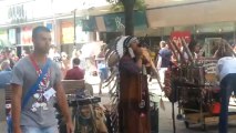 a man playing music in Manchester city centre.