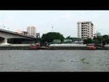 Cargo barges moving up the Chao Phraya River at Bangkok