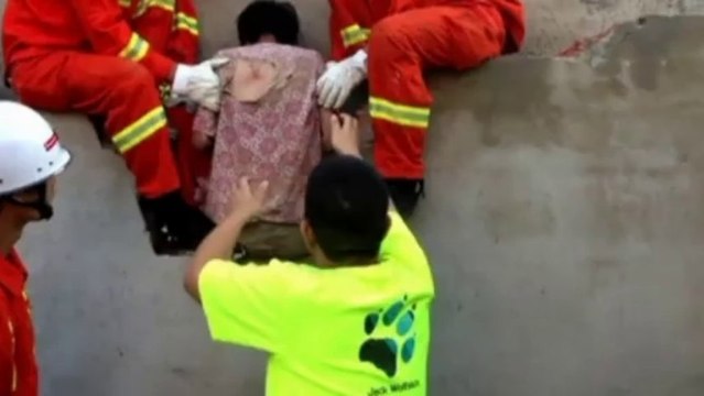 Firefighters save woman stuck between two walls in China
