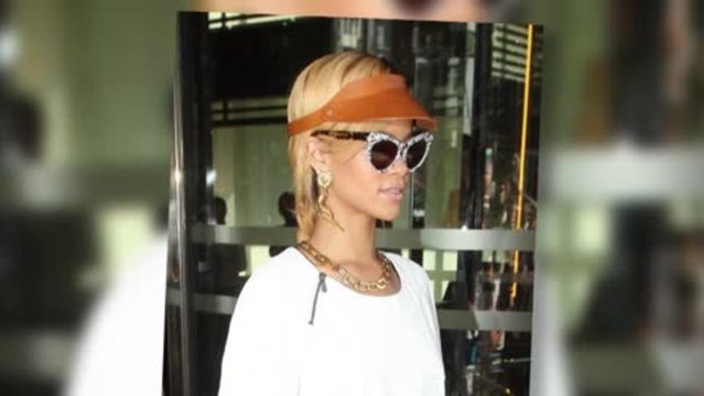 Rihanna is a Bangin' Babe as She Wears Gun Earrings