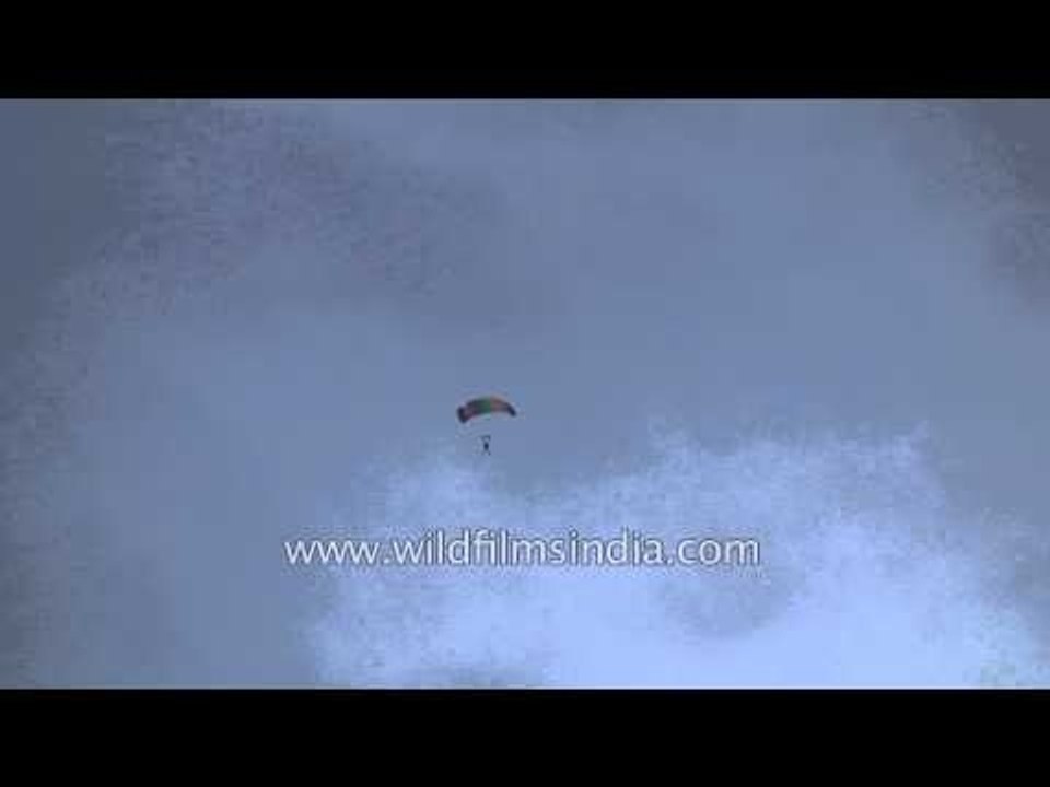 Paraglider soars in the air