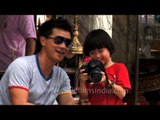 Little Thai amatuer photographer at Erawan Shrine, Bangkok