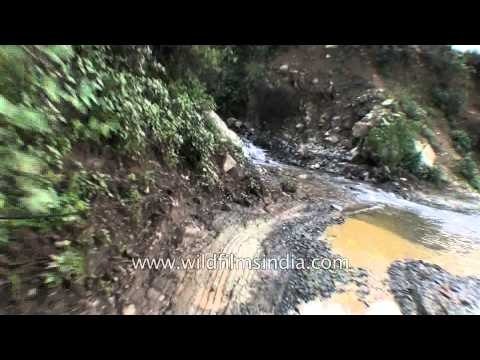 Driving through pot-holed partially destroyed roads in Uttarakhand, post the flood