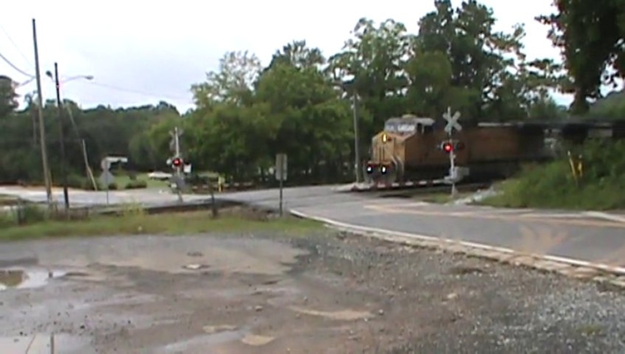 Norfolk Southern Triple Crown roadrailer Train southeast through Mableton Ga. with a Union Pacific unit in the lead.