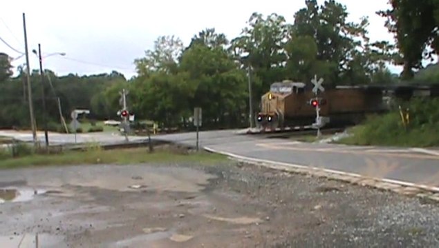 Norfolk Southern Triple Crown roadrailer Train southeast through Mableton Ga. with a Union Pacific unit in the lead.
