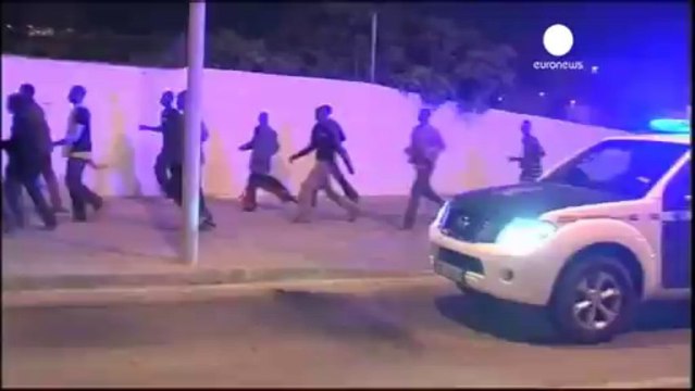 African migrants storm Spanish border fence