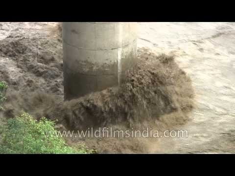 River lashes the foot of a bridge: post Uttarakhand flood scenario