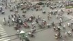 Crazy traffic at road Intersection in Vietnam - Thousands of Motorbikes & Scooters