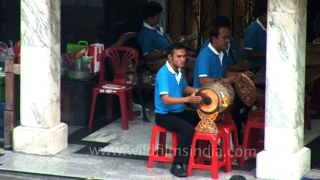Drummers at shrine of Erawan near Grand Hyatt, Bangkok