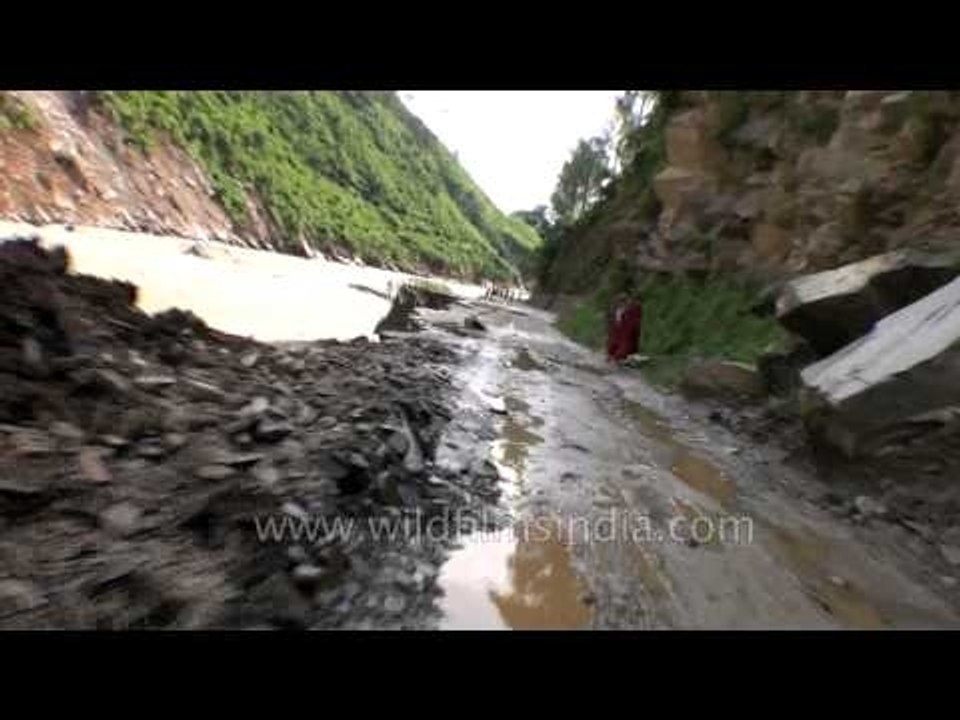 Damaged road in flood-hit Uttarakhand