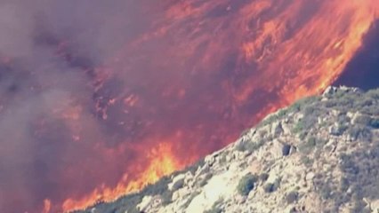 More evacuations from huge wildfire