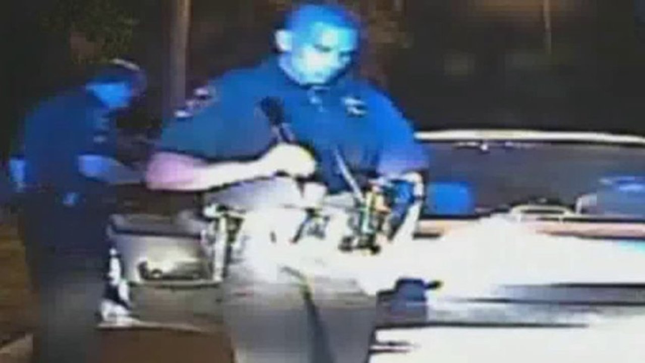Policeman forces woman to shake bra