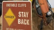 Man survives driving off cliff